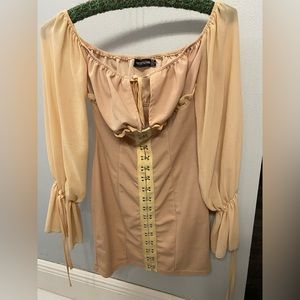 Long sleeve corset style dress.